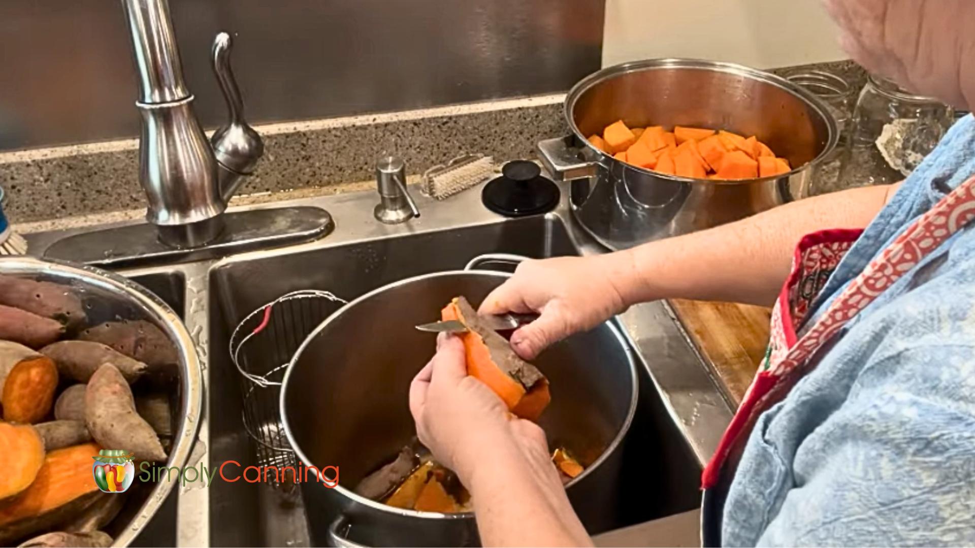 Peeling sweet potatoes into a pot in the sink keeps things clean and is easier on the arms.