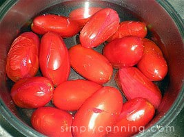 Roma tomatoes with their skins starting to split.