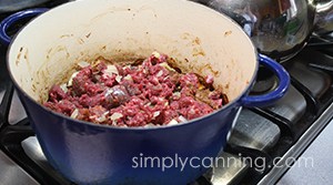 Browning ground meat and onions in a heavy skillet.