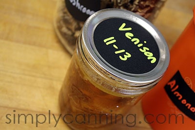 A jar of venison labeled with a round Chalky Talky label.