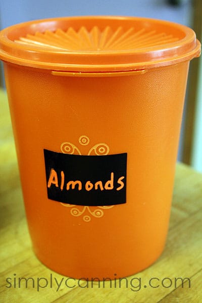 A canister of almonds labeled with one of the Chalky Talky labels.