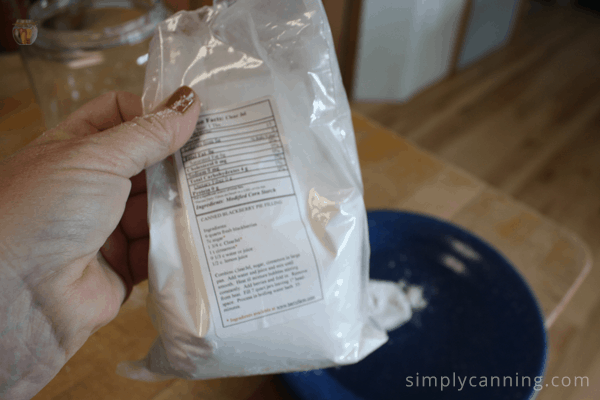 Sharon holding a package of Clear Jel over a plate.