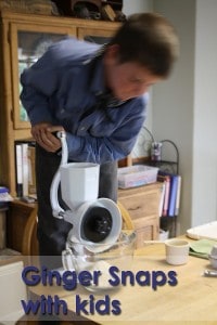 My son grinding the Wonder Jr Delux grain mill by hand.