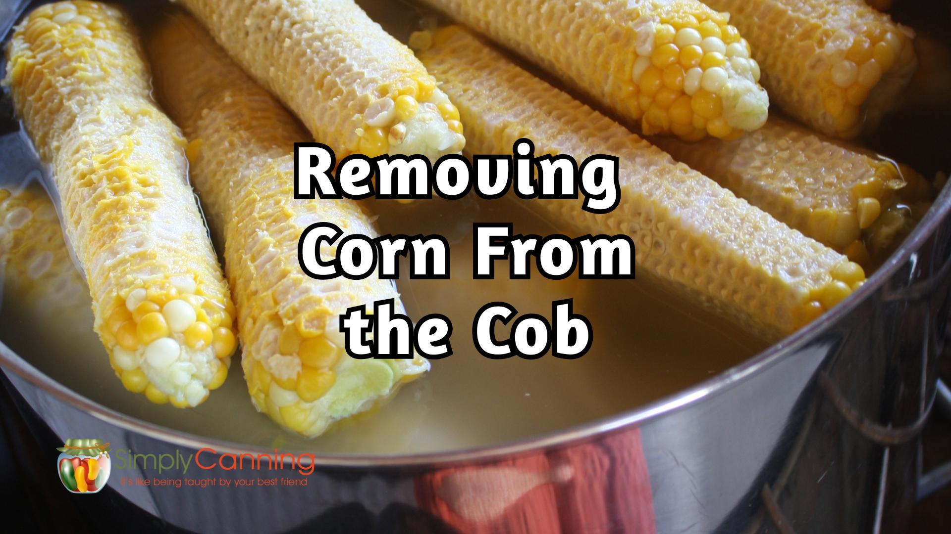 Close up of empty corn cobs in a stock pot, titled removing corn from the cob.