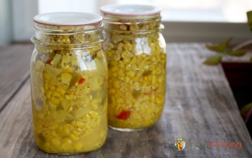 Two pint jars packed with colorful corn relish.