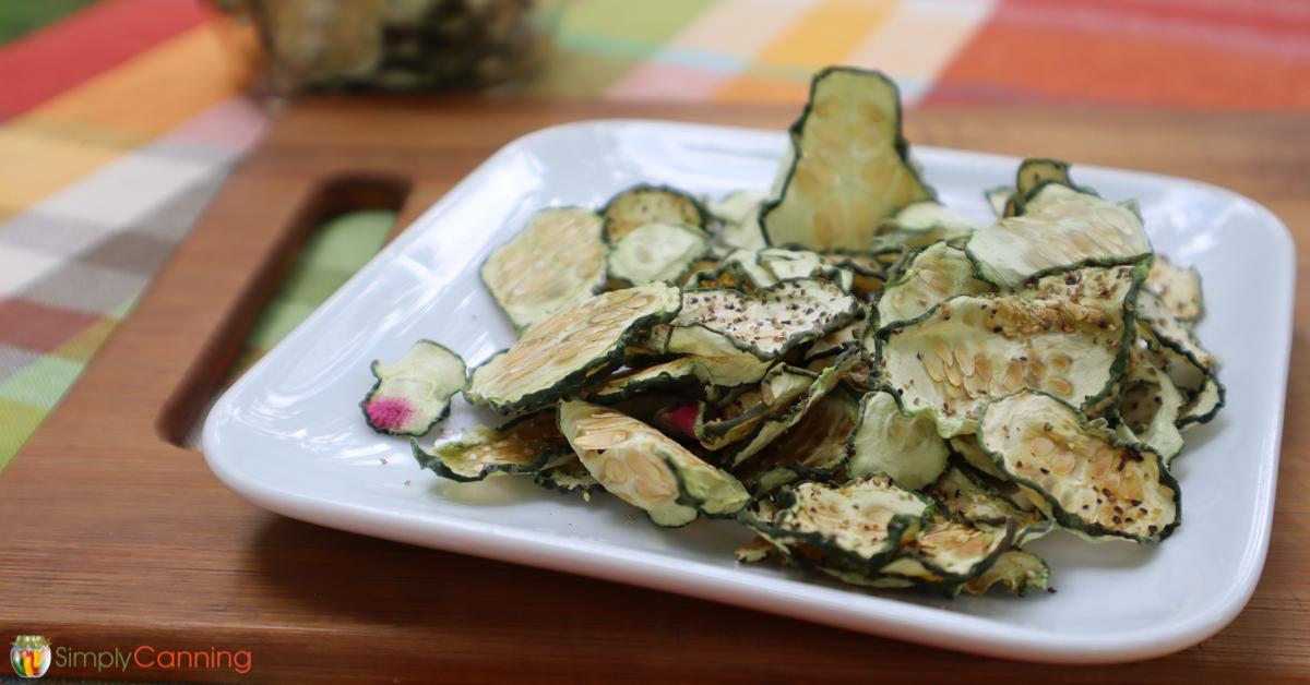 Dried cucumber chips sitting on a plate.