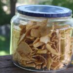 A jar filled with soft dehydrated apple slices