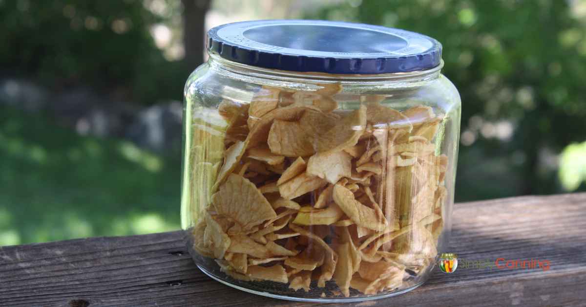 A jar filled with soft dehydrated apple slices