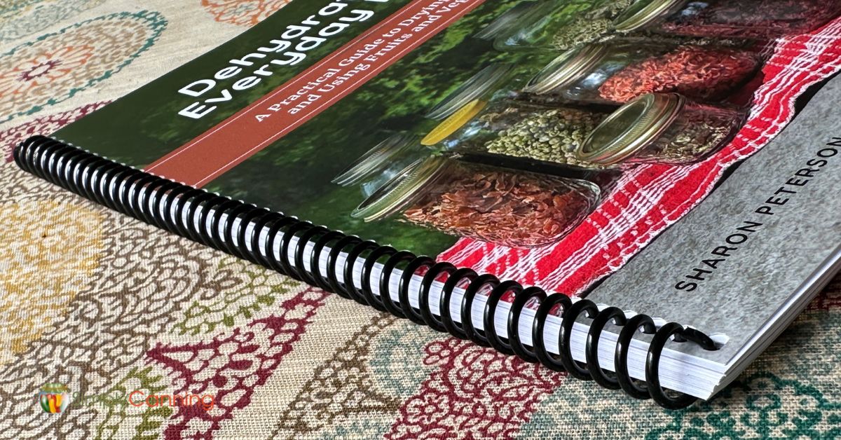 Dehydrating Everyday Foods guide closeup of lay flat spiral binding.