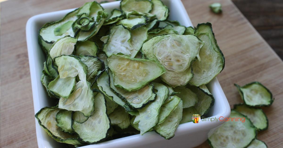 Dried zucchini slices in a white dish.