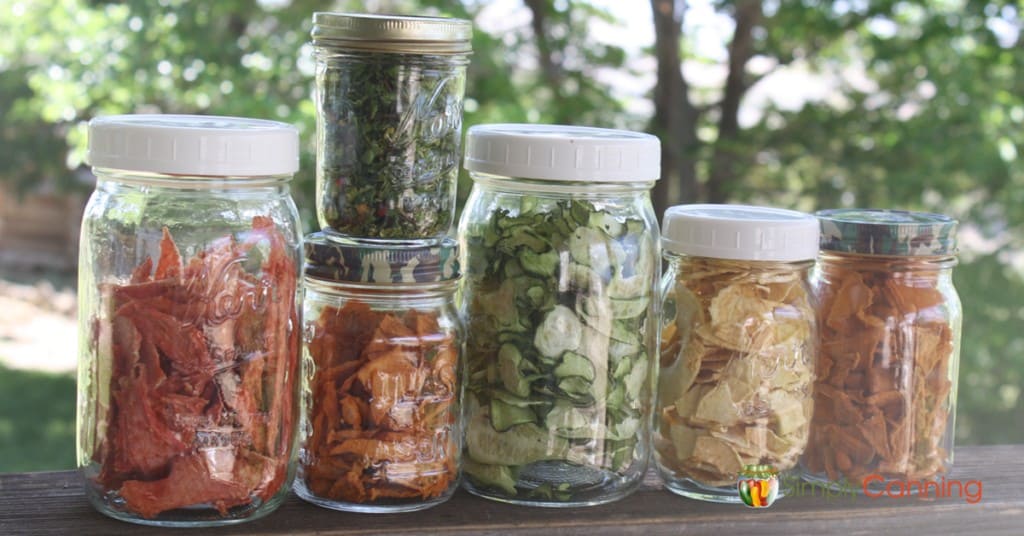 Jars filled with various kinds of dehydrated fruits and vegetables.