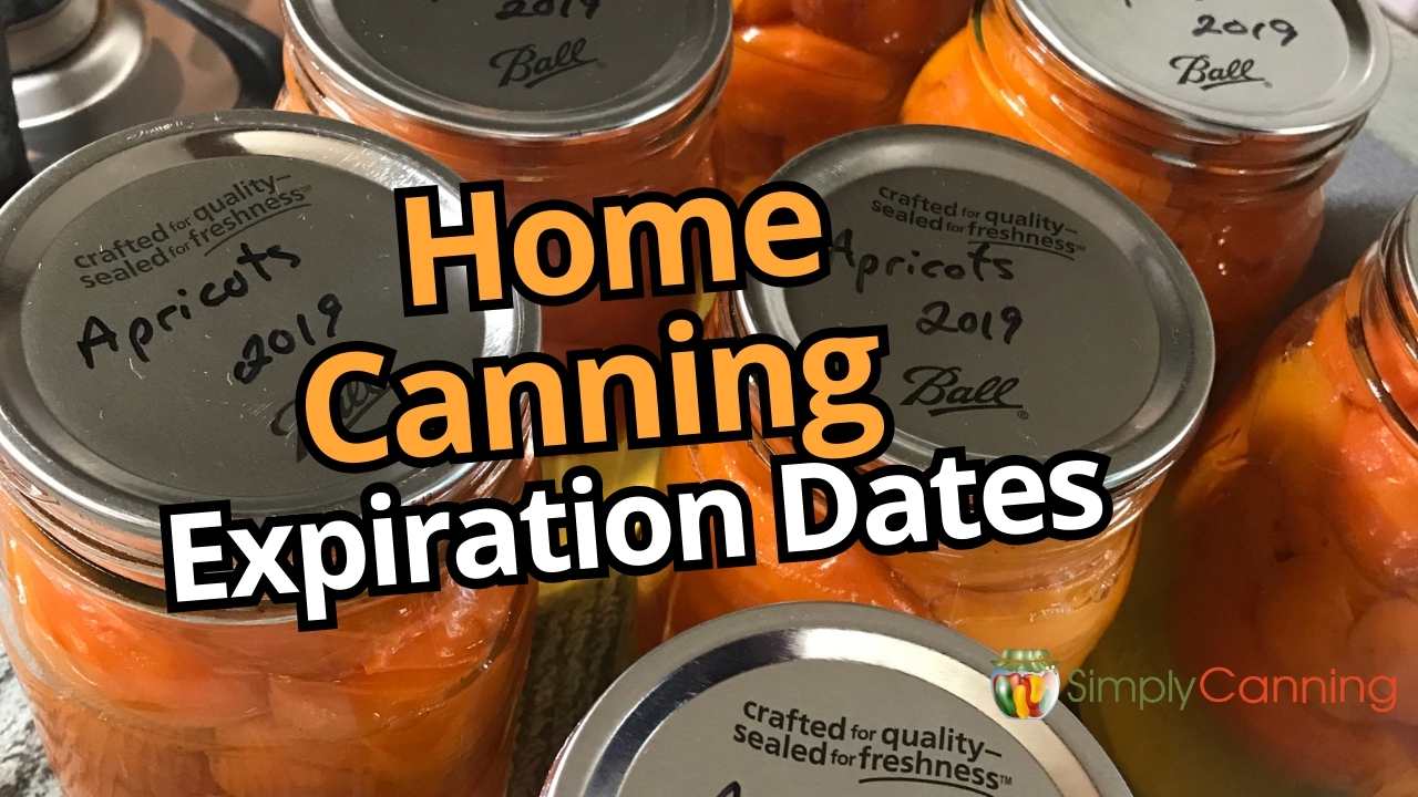 Image of jars of home canned apricots with the date written on top in black sharpie marker.