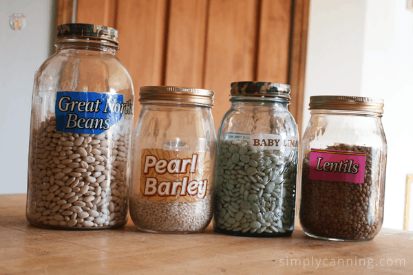 Jars filled with legumes and pearled barley.