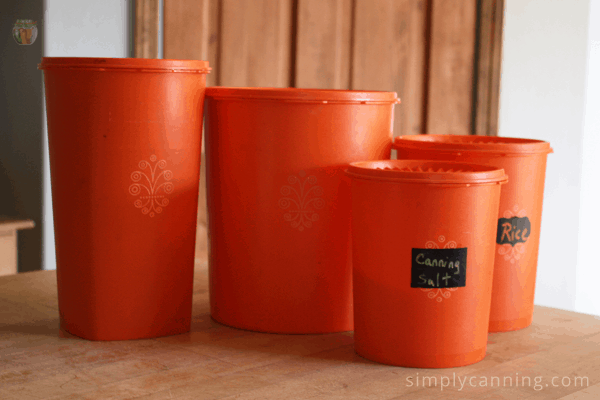 Orange plastic storage canisters sitting on the countertop.