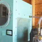 Blue freeze dryer attached to the pump equipment.