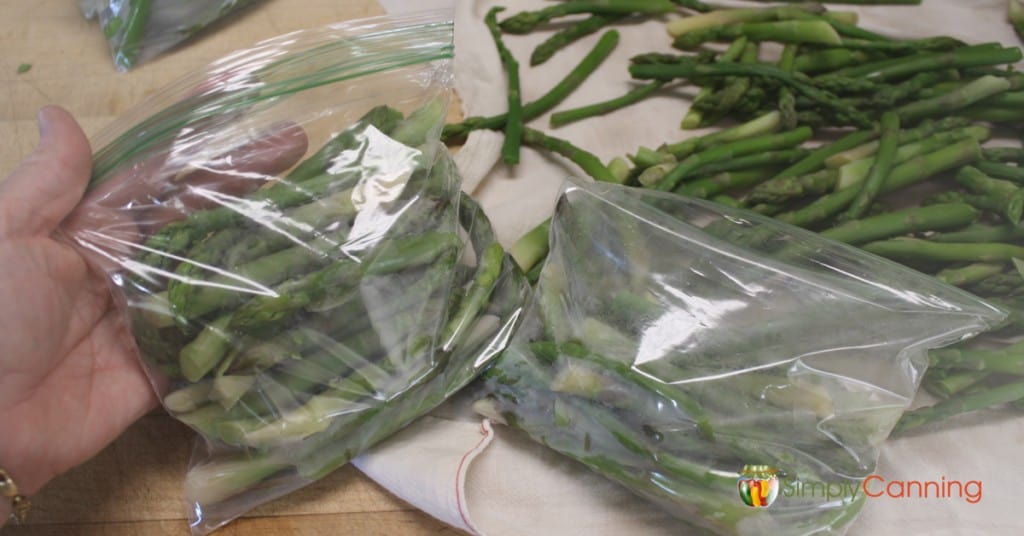 Freezing asparagus in small bags.