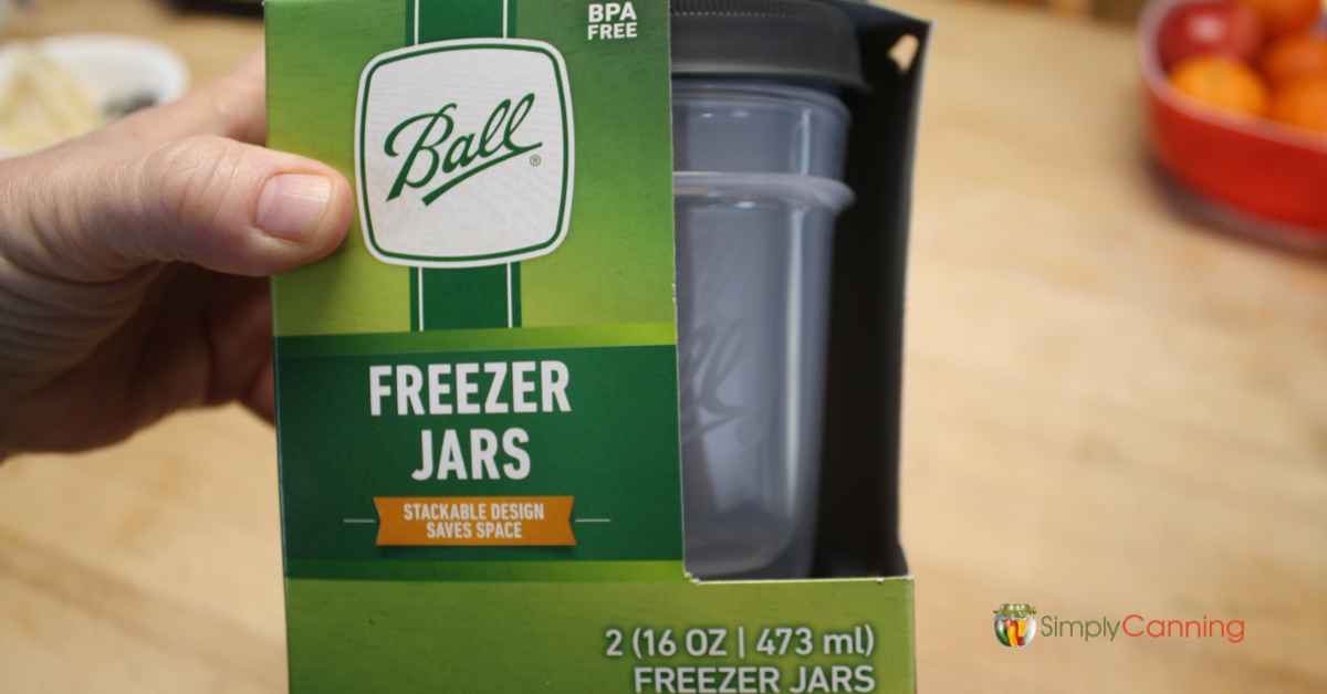 Holding the package of Ball Freezer Jars.