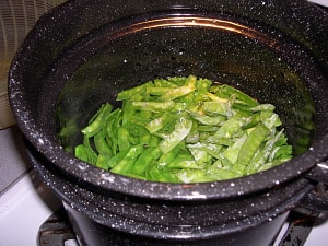Peas blanching in hot water.