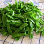 Blanched peas drying off in a towel.
