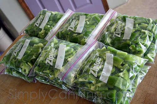 Ziploc freezer bags packed with chopped green peppers and waiting to be placed in the freezer.