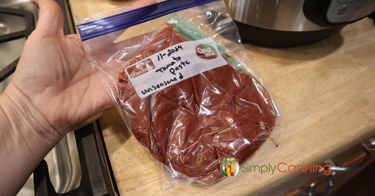 Homemade tomato paste in freezer bags ready for the freezer.