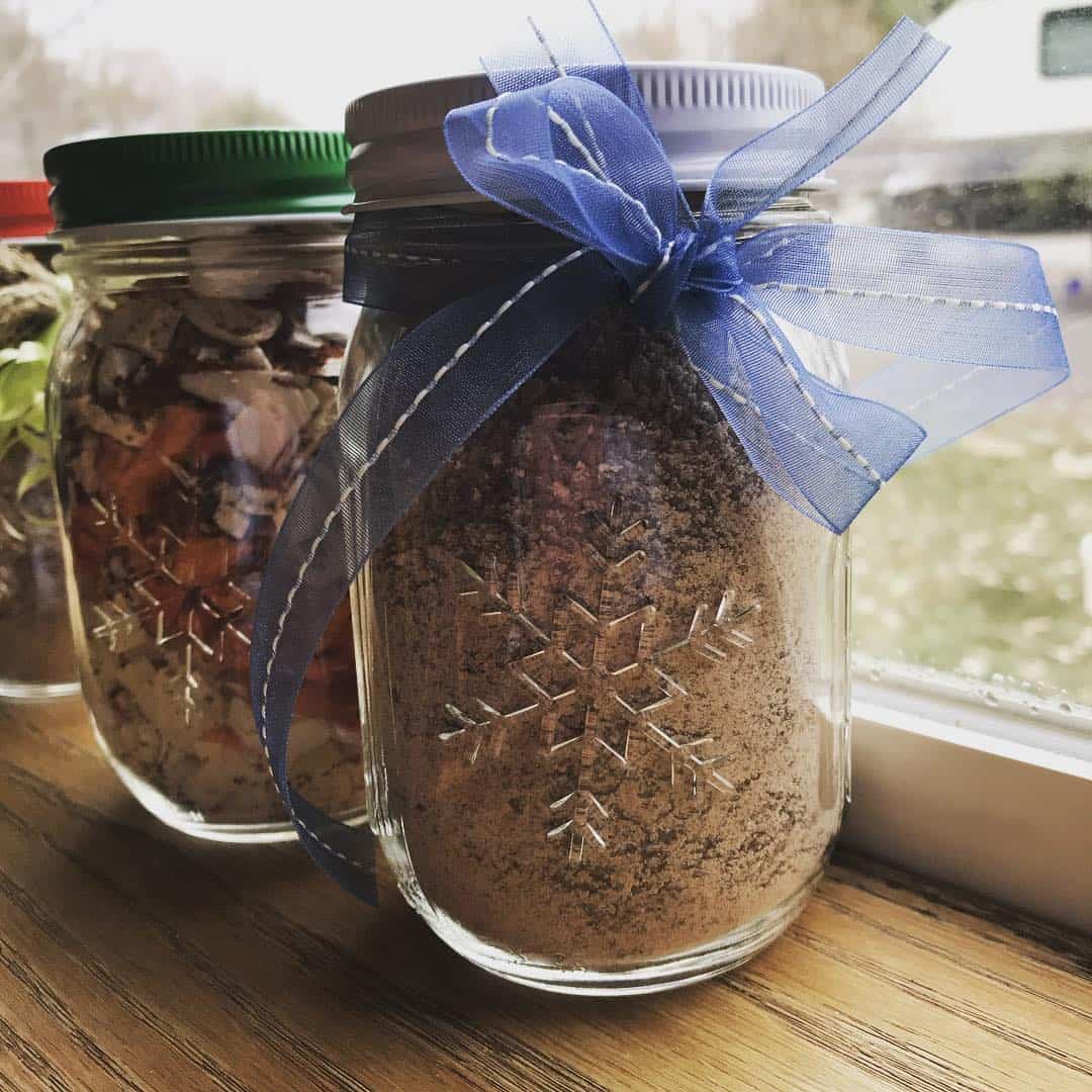 Decorated jars filled with dry ingredients.