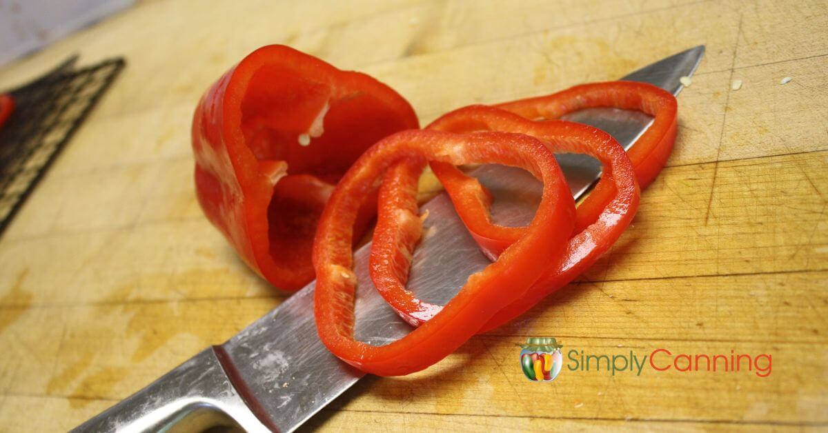 Red Peppers sliced into rings ready to go in the dehydrator.