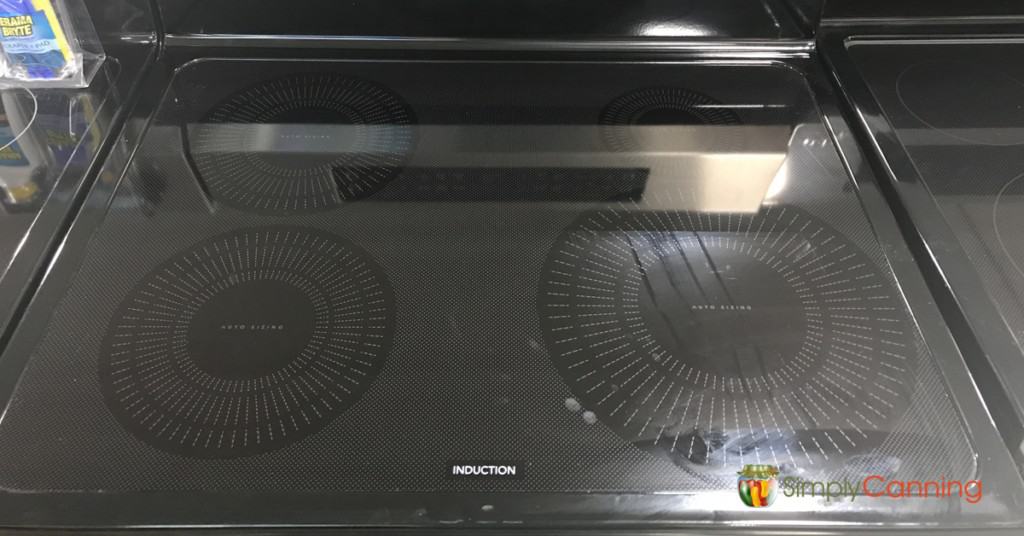 Looking down on the shiny surface of an induction stove.