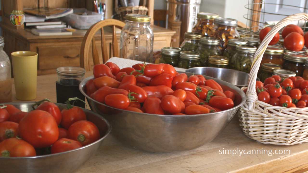 Many varieties of tomatoes on my kitchen counter, 3 varieties in  baskets and bowls. 
