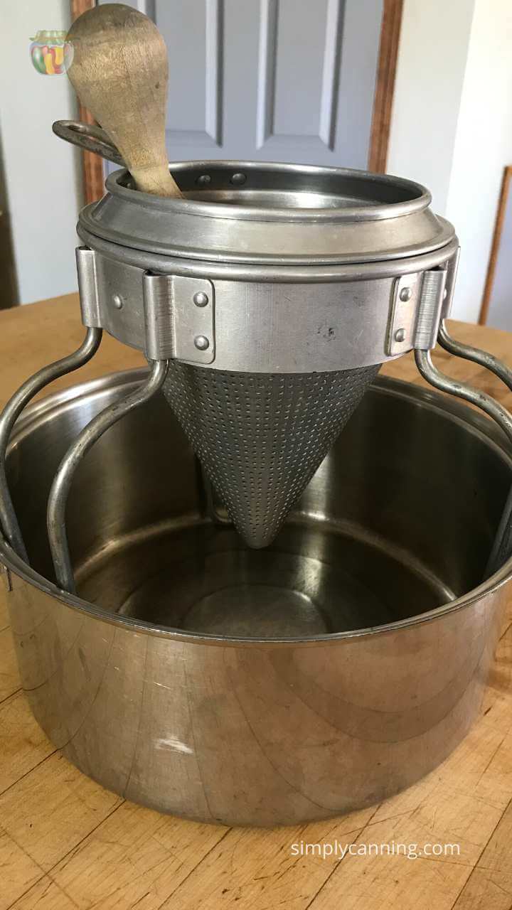 Vintage strainer in a large sauce pot. 