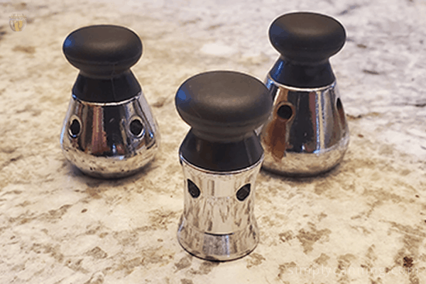 Three different weights used on the Mirro pressure canner.