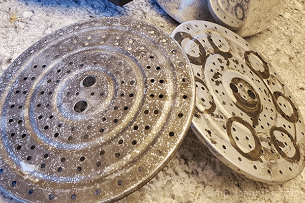 Pressure canner racks with canning stains on them.