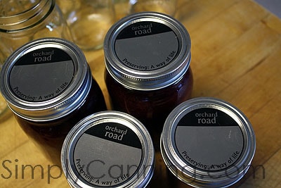 Canning jars topped off with the simple Orchard Road canning lids.