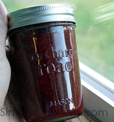 Sharon holding a filled Orchard Road jar.