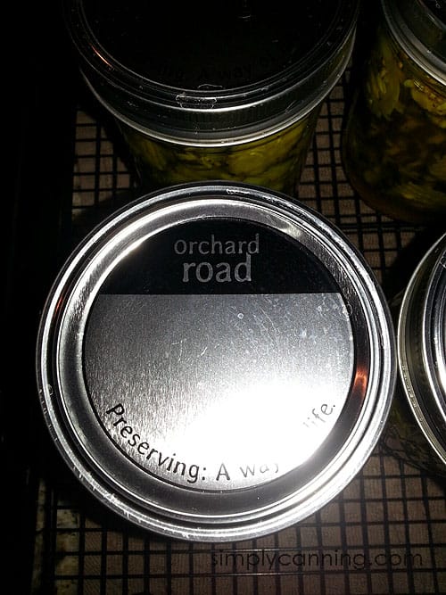 Looking down at the Orchard Road canning lid on top of a jar.