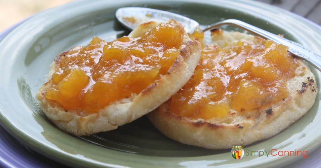 Peach jam spread over toasted English muffins.