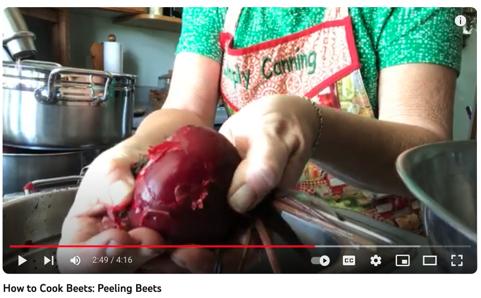 Close up of Sharon peeling beets. 