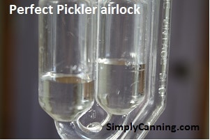 Perfect Pickler airlock system uses water in the tubes.