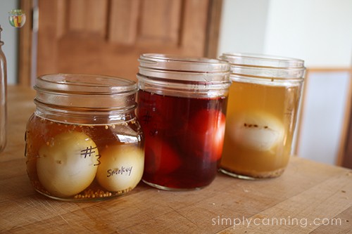 Jars of pickled eggs labeled with a Sharpie.
