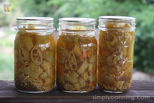 Three jars of pickled pepper rings.
