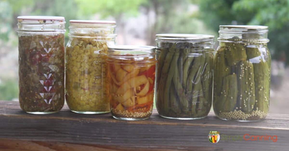 Jars of home canned pickled vegetables and relishes.