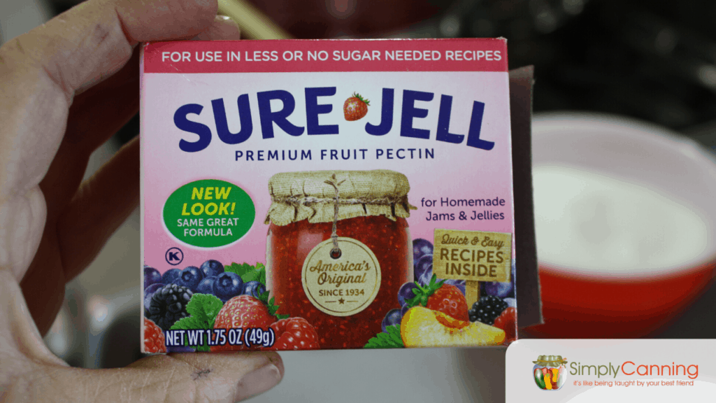 Package of SureJell Premium Fruit Pectin that is illustrated with a canning jar on the front.