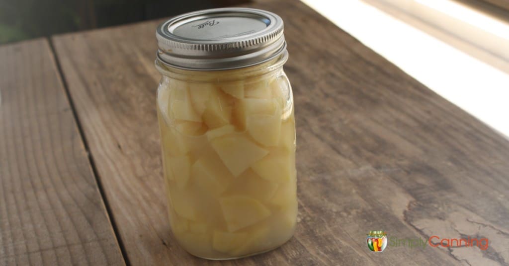 A jar of home canned potato chunks.
