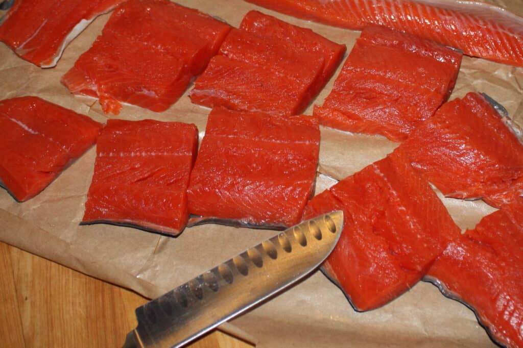 Drying off pieces of salmon.