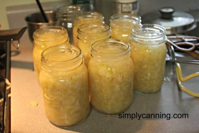Jars filled with sauerkraut.