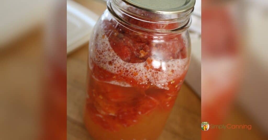 A strangely bubbling jar of canned tomatoes.