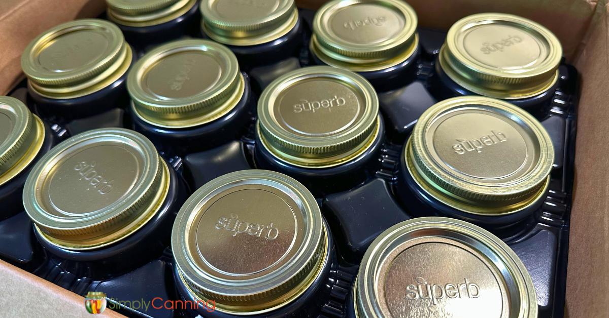 Super canning lids and rings in the box on the black insert. 
