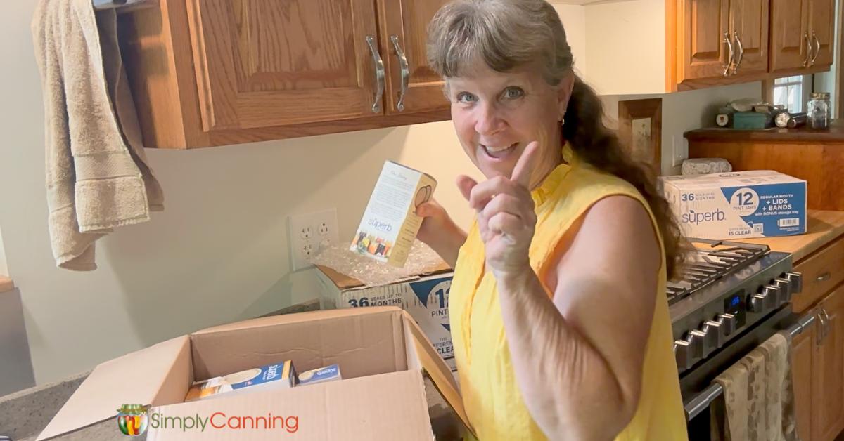 Sharon with a big smile, being ridiculously excited over the sleeves of lids in the box. 