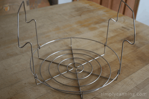 An example of a water bath canner rack with handles on the sides.