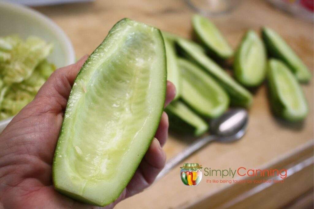 Half a large zucchini with seeds scraped out, ready for use in zucchini recipes.